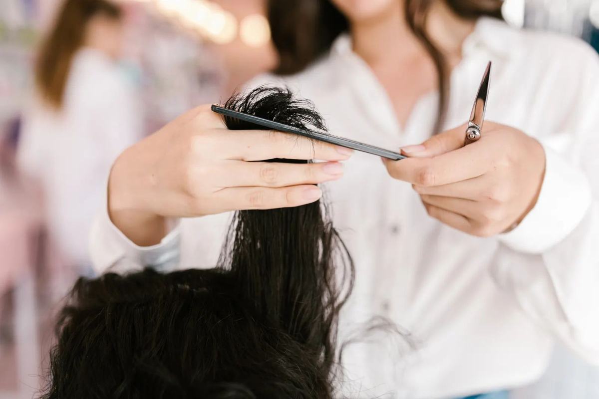 Stylist hands sectioning hair